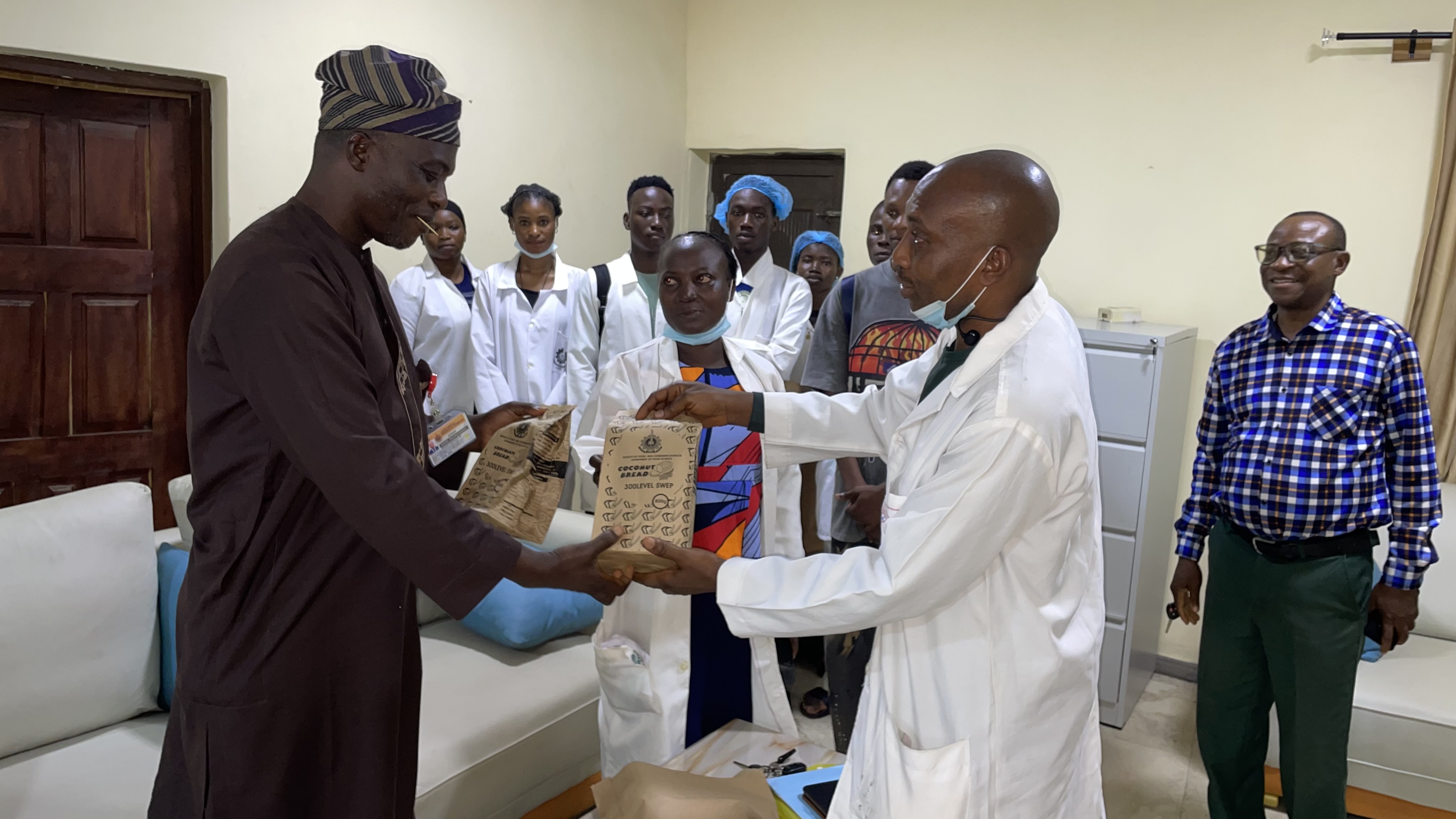 COCONUT BREAD PRESENTATION to Deputy Vice-Chancellor (Academics and Innovation)